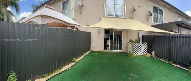 a view of a back yard of the house