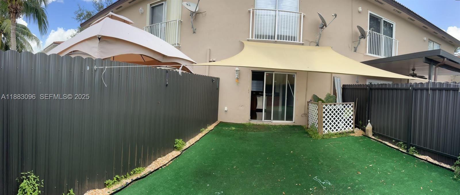 17018 Southwest 138th Court Miami, FL 33177 - Photo 16 of 22 a view of a back yard of the house