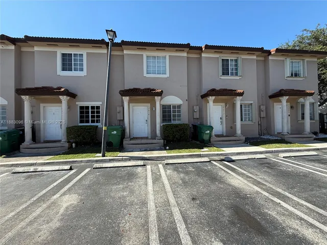 a front view of a house with lots of white lighting