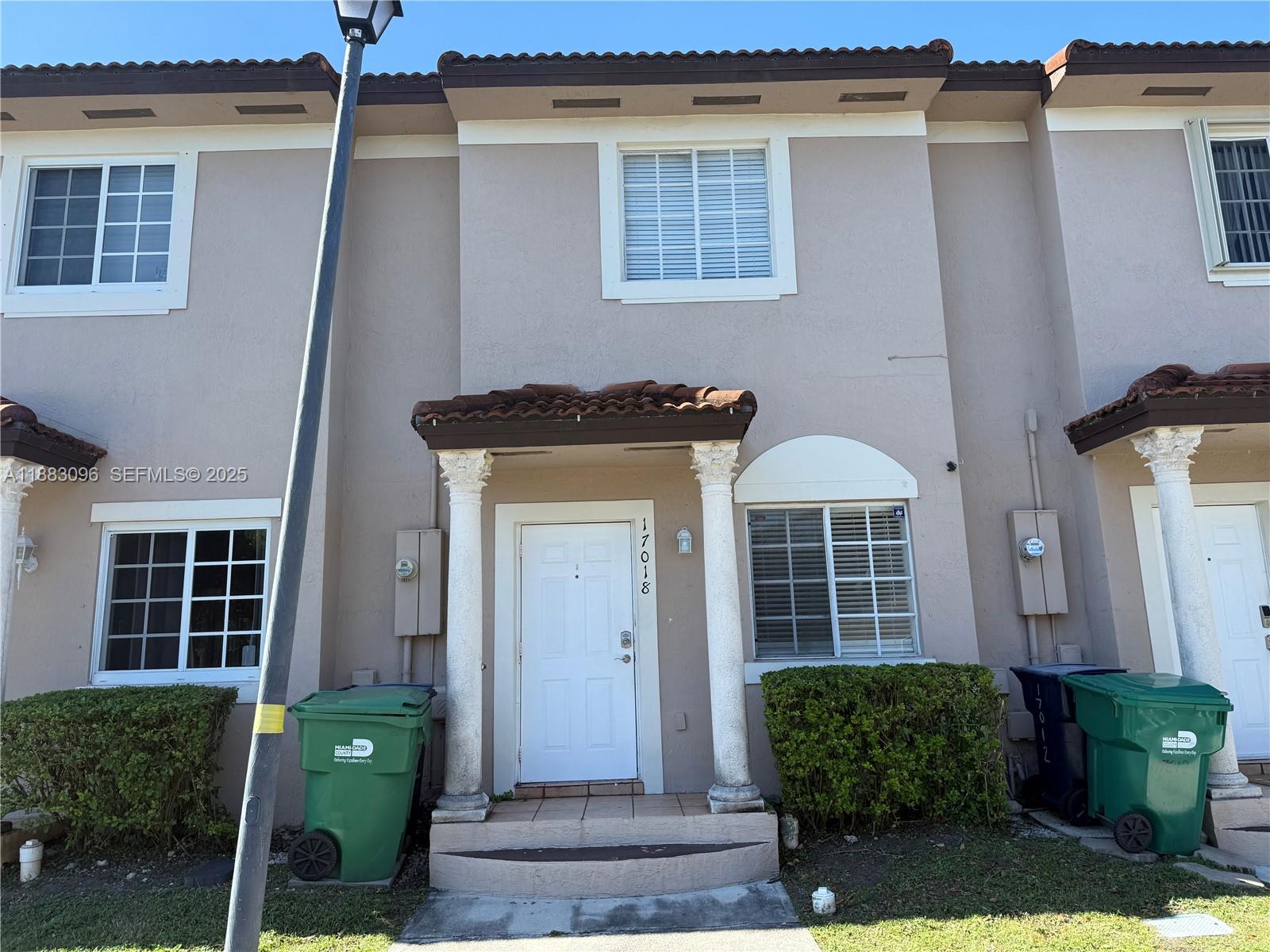 17018 Southwest 138th Court Miami, FL 33177 - Photo 18 of 22 a front view of a house with garden