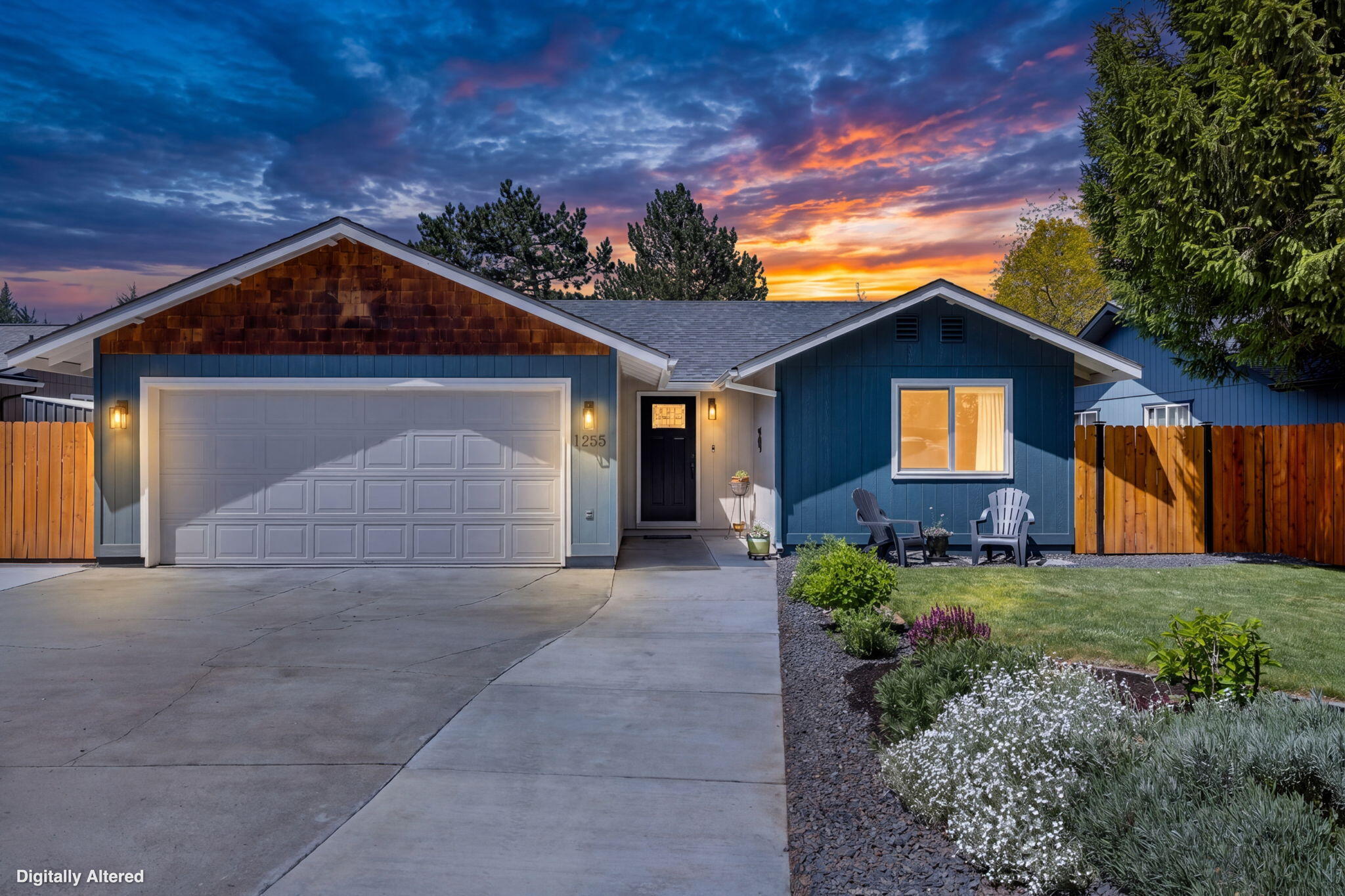 1255 Southwest 28th Street Redmond, OR 97756 - Photo 12 of 40 a front view of a house with a yard and garage