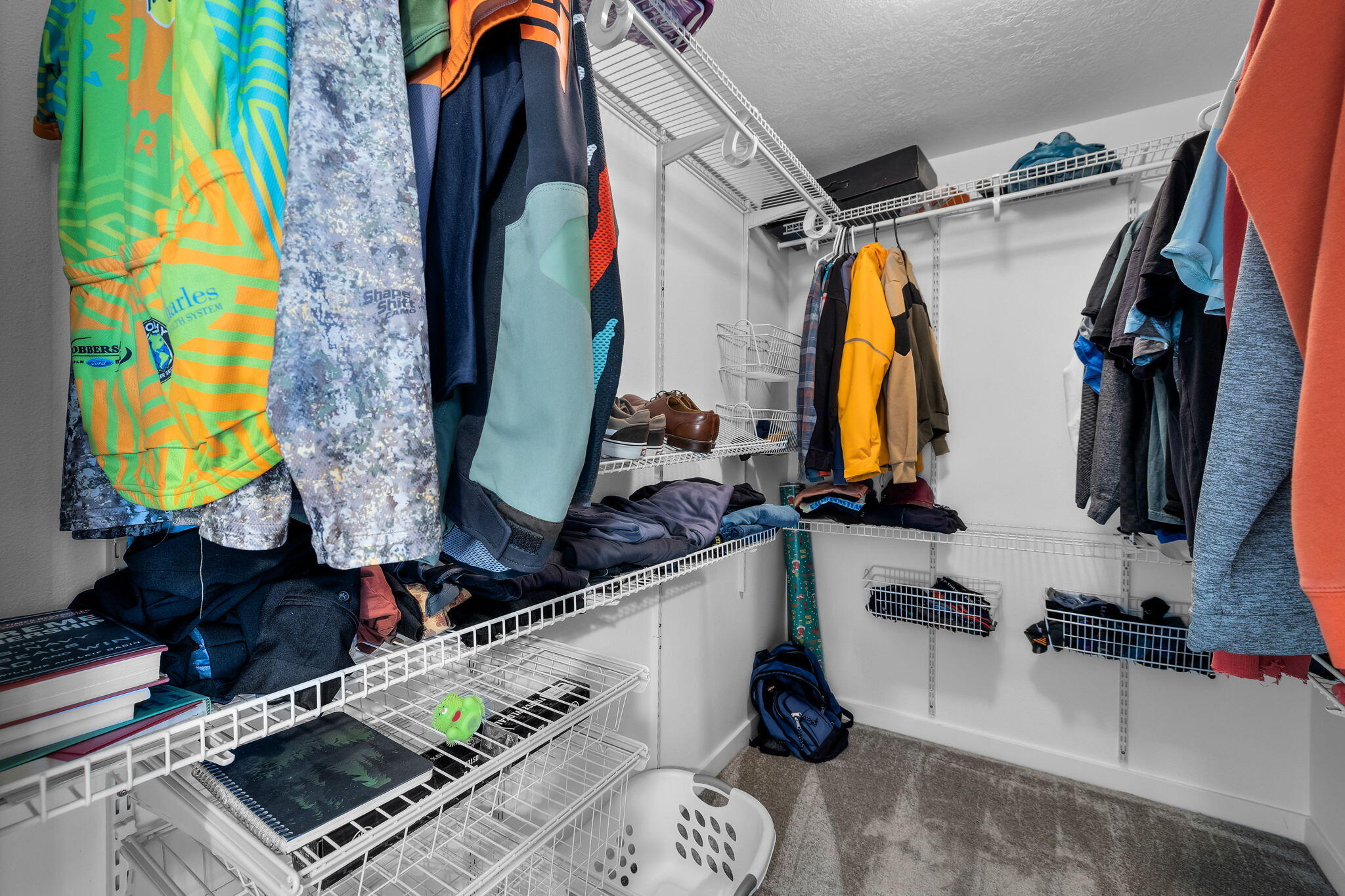 1255 Southwest 28th Street Redmond, OR 97756 - Photo 24 of 40 a view of walk in closet with clothes and shoes