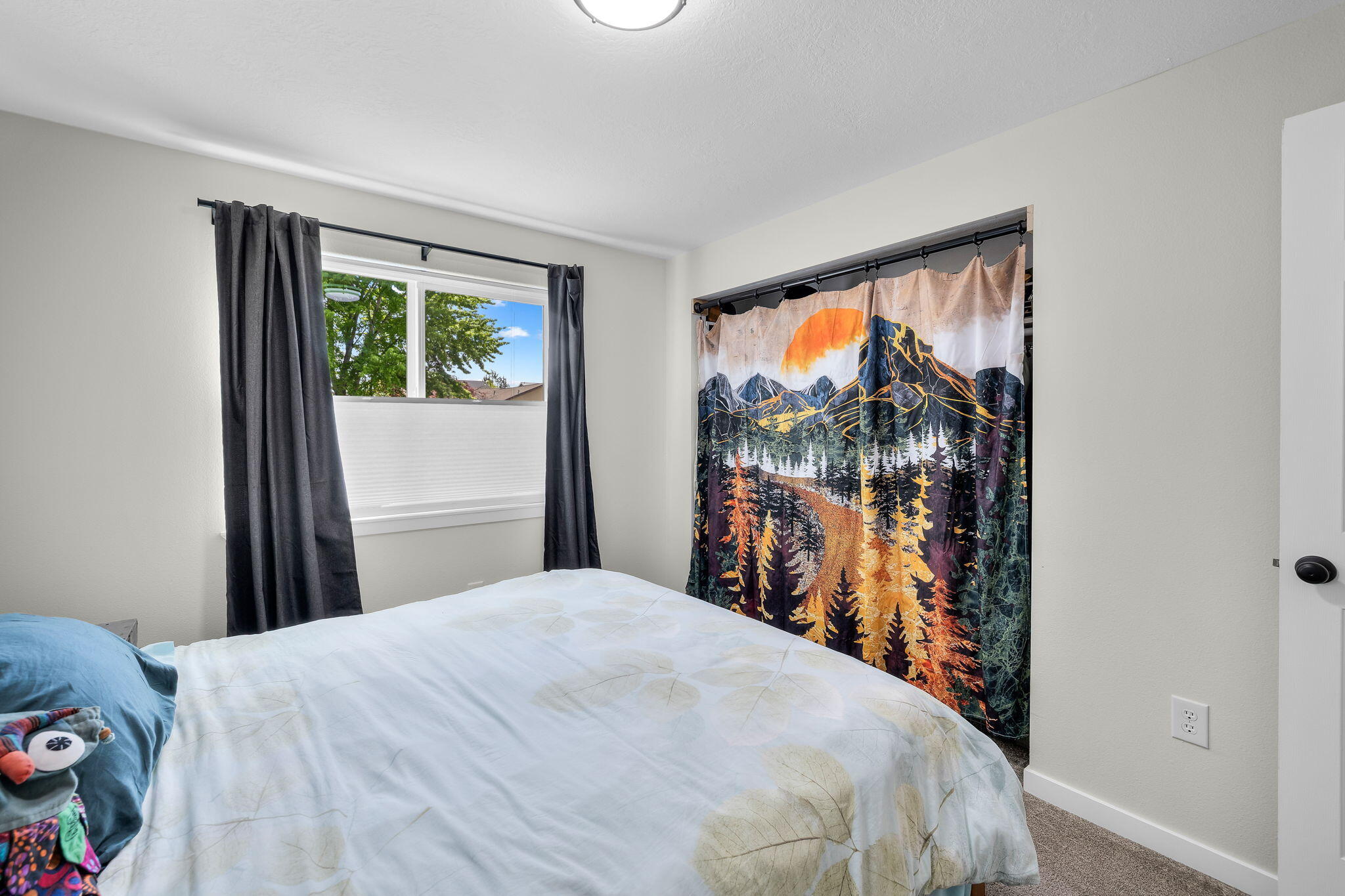 1255 Southwest 28th Street Redmond, OR 97756 - Photo 26 of 40 a bedroom with a bed and a window