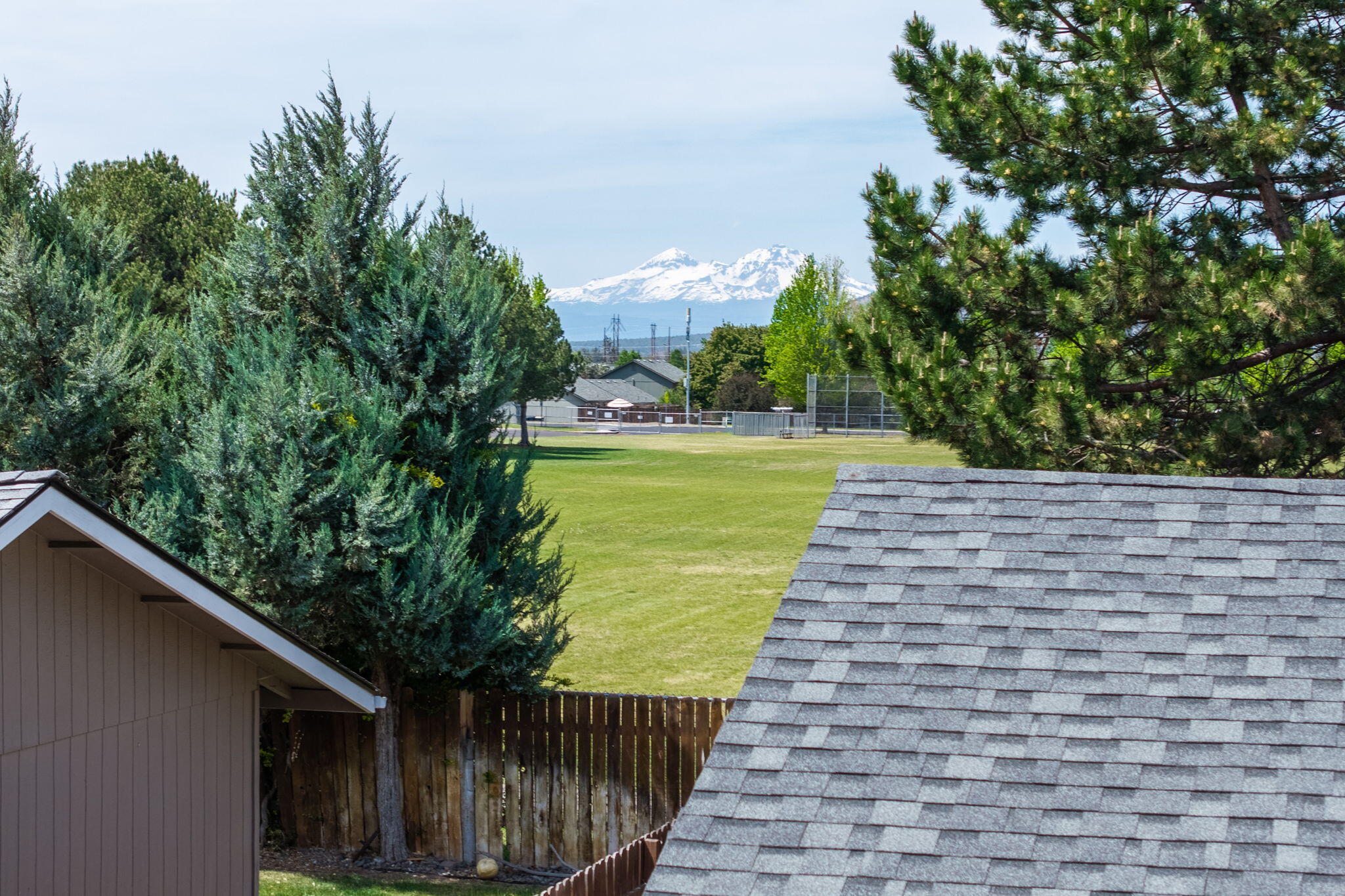 1255 Southwest 28th Street Redmond, OR 97756 - Photo 34 of 40 a view of a yard with an empty space and wooden fence