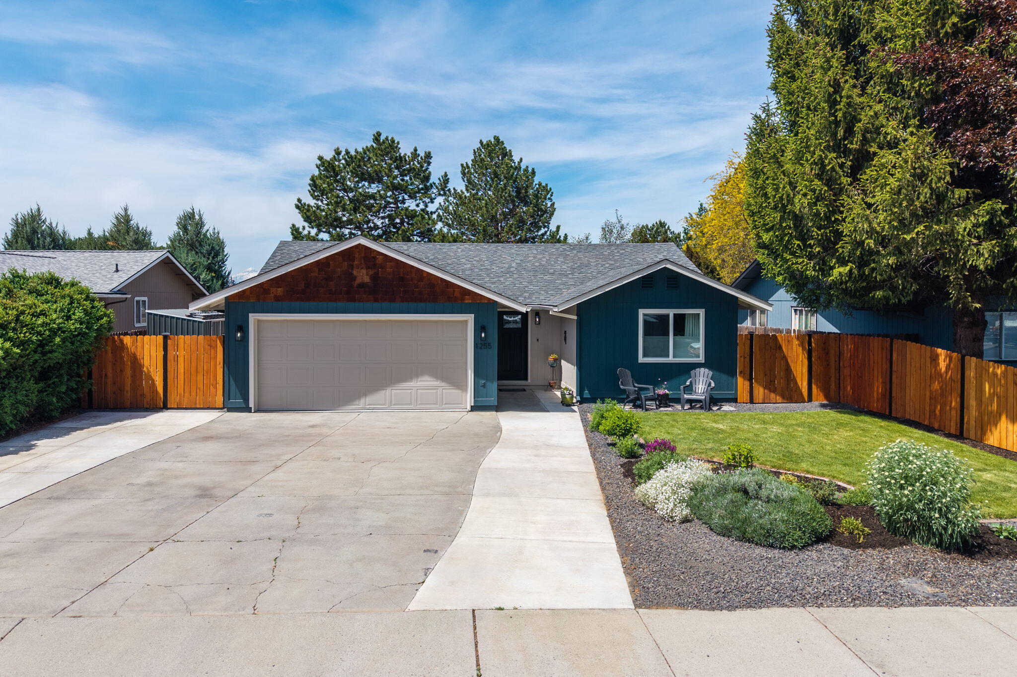 1255 Southwest 28th Street Redmond, OR 97756 - Photo 35 of 40 a front view of a house with a yard and garage