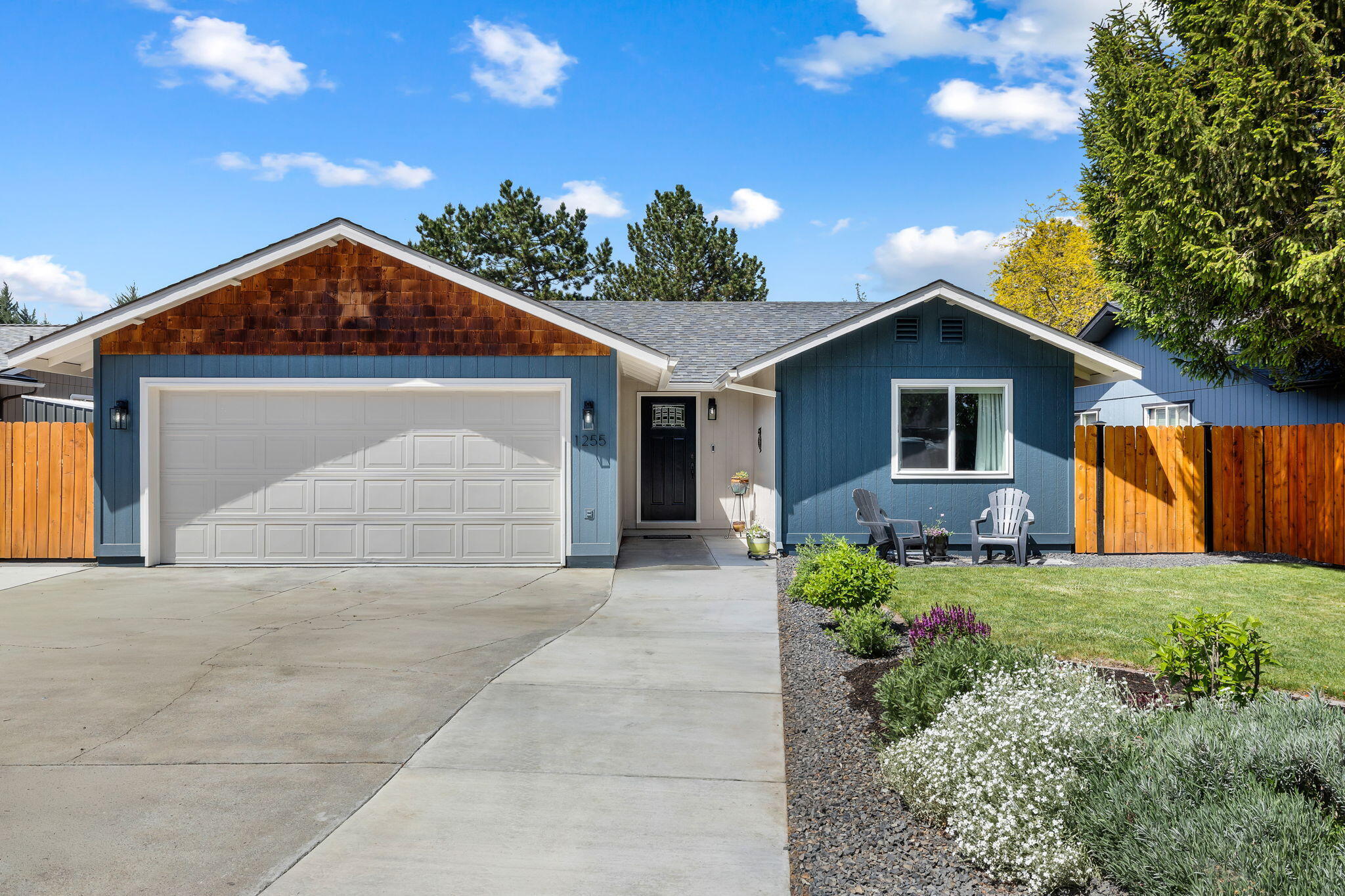 1255 Southwest 28th Street Redmond, OR 97756 - Photo 40 of 40 a front view of a house with a yard and garage
