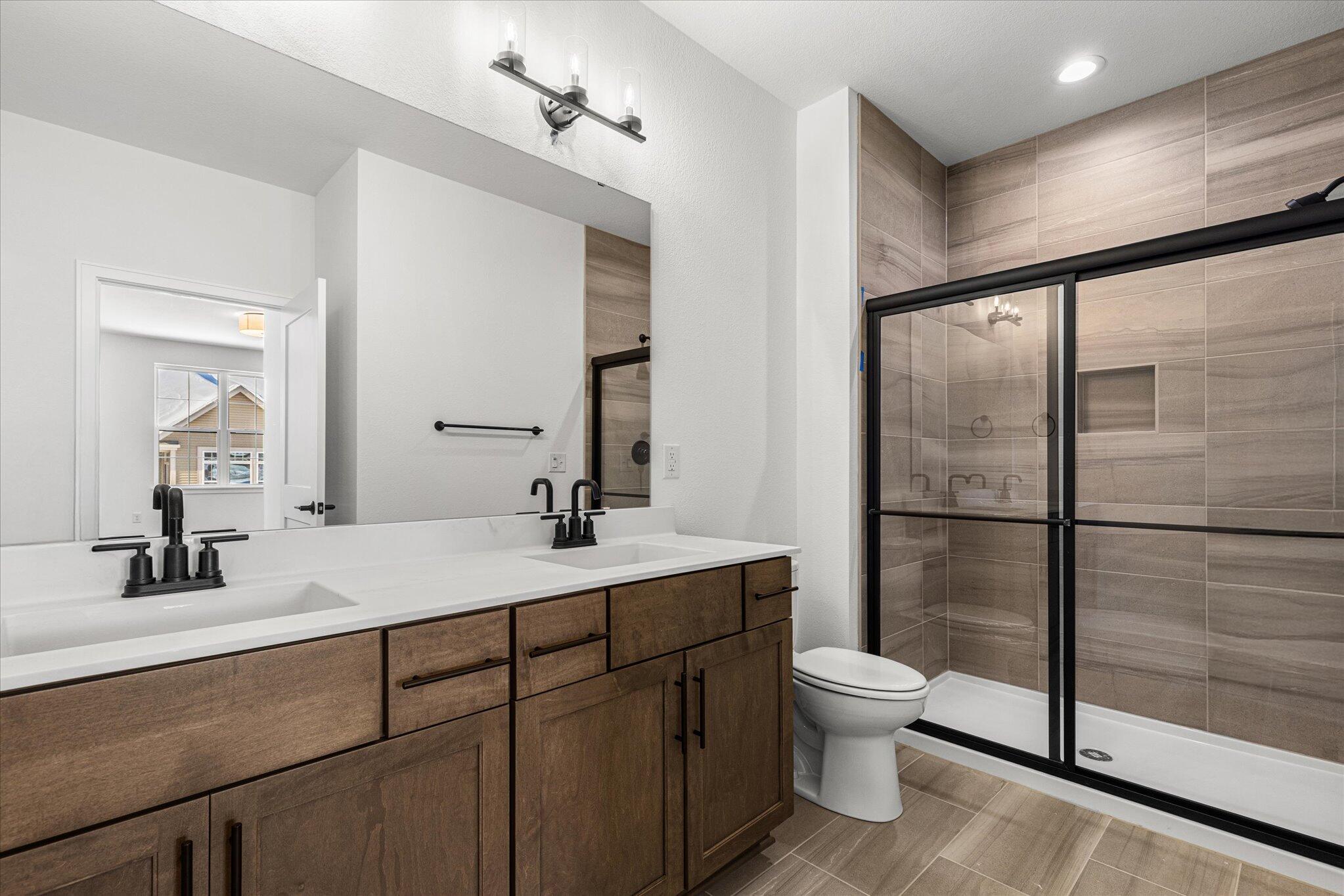 674 Mary Way Slinger, WI 53086 - Photo 16 of 24 674 Mary Way 16 Primary Bathroom