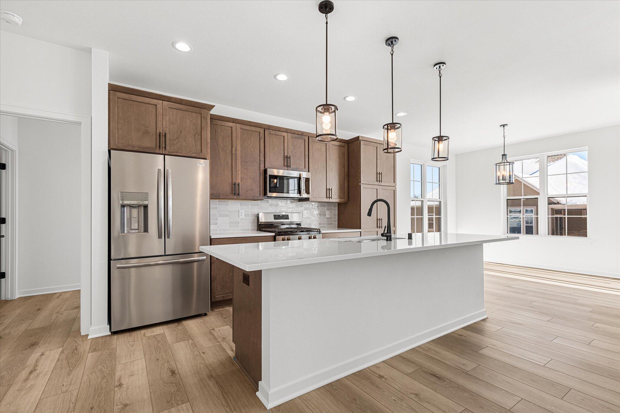 674 Mary Way Slinger, WI 53086 - Photo 3 of 24 674 Mary Way 03 Kitchen and Dining