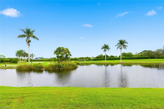 a view of a lake with a house in the background