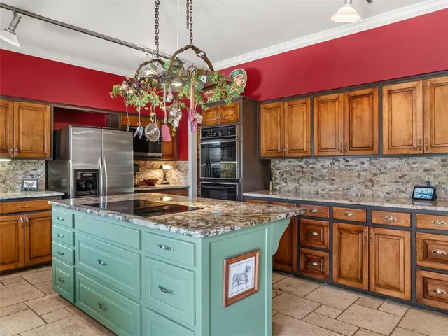 a kitchen with a sink stove and cabinets