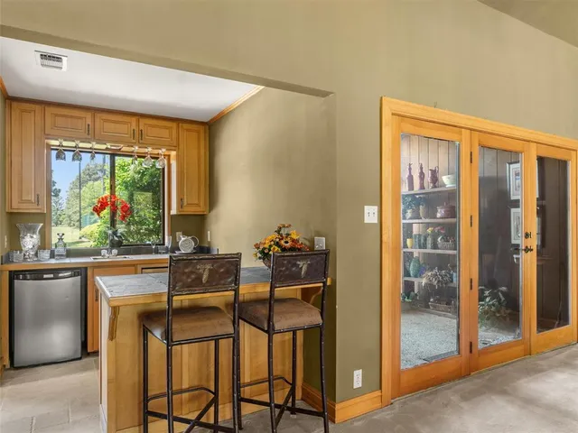 a dining room with furniture and window