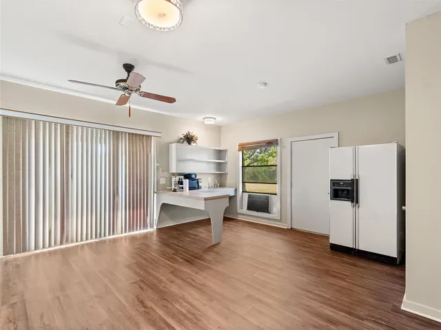 a view of kitchen with furniture and wooden floor