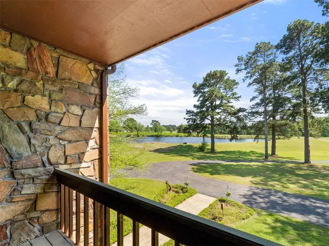 a view of a yard and an ocean view