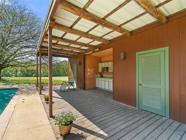 a porch with wooden floor