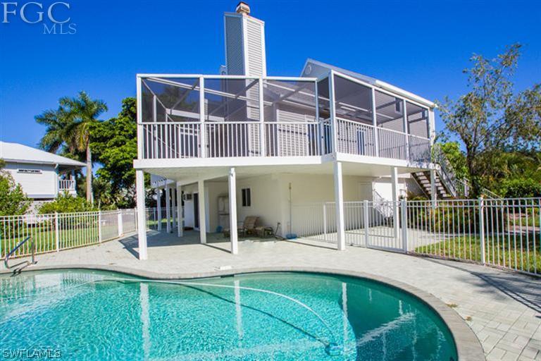 a view of an house with backyard porch and sitting area