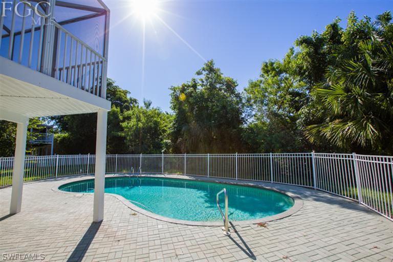 1342 Sand Castle Road Sanibel, FL 33957 - Photo 15 of 17 a view of a swimming pool with a patio