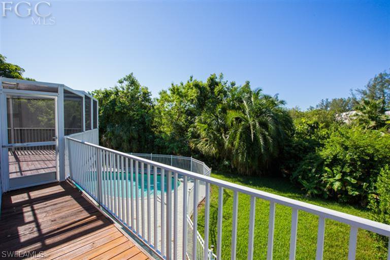 1342 Sand Castle Road Sanibel, FL 33957 - Photo 16 of 17 a balcony with trees in front of it