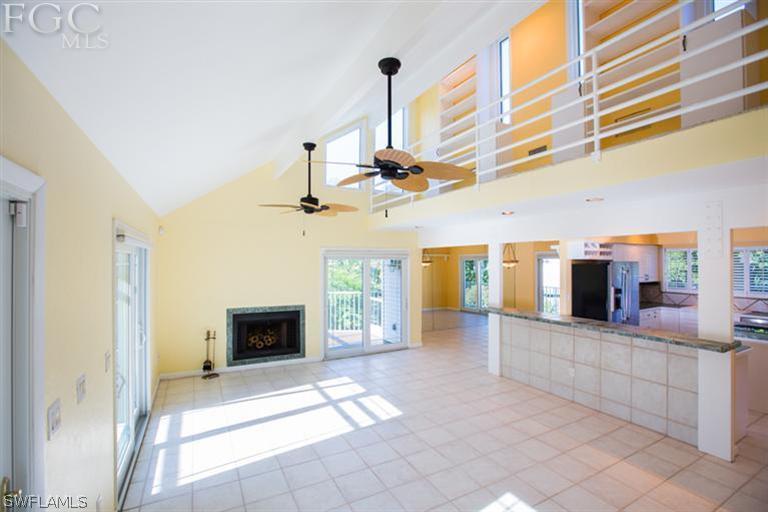 1342 Sand Castle Road Sanibel, FL 33957 - Photo 3 of 17 a view of a kitchen with a sink and a fireplace