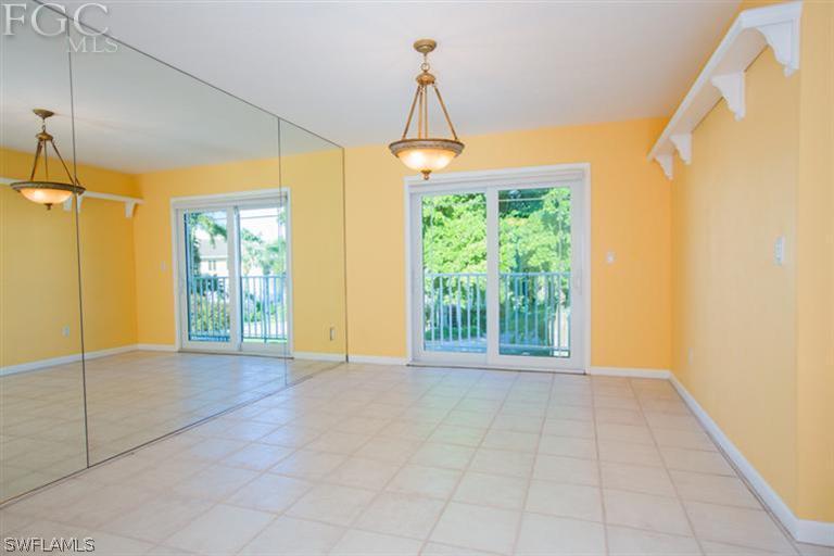 1342 Sand Castle Road Sanibel, FL 33957 - Photo 8 of 17 a view of an empty room with glass door