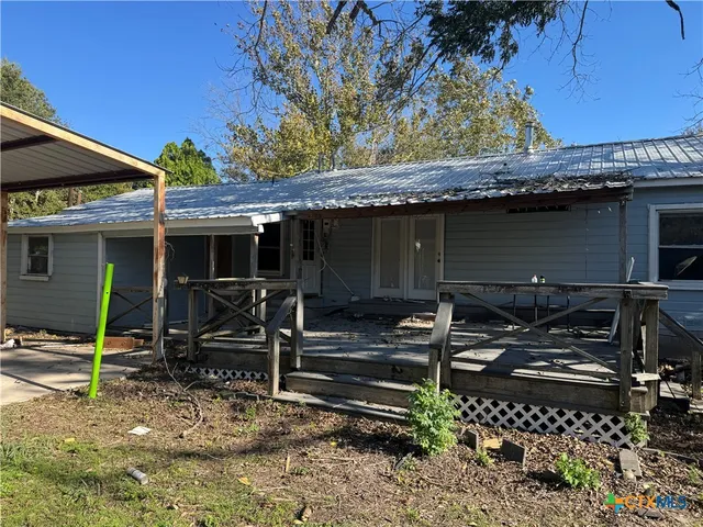 a view of the house with backyard