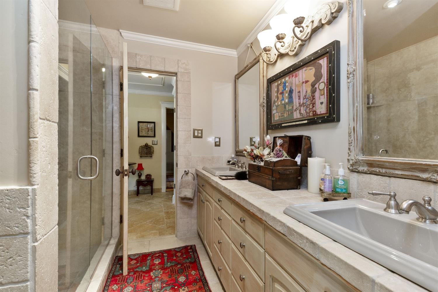 267 Fairview Road Ojai, CA 93023 - Photo 19 of 50 a bathroom with a sink a mirror and a shower