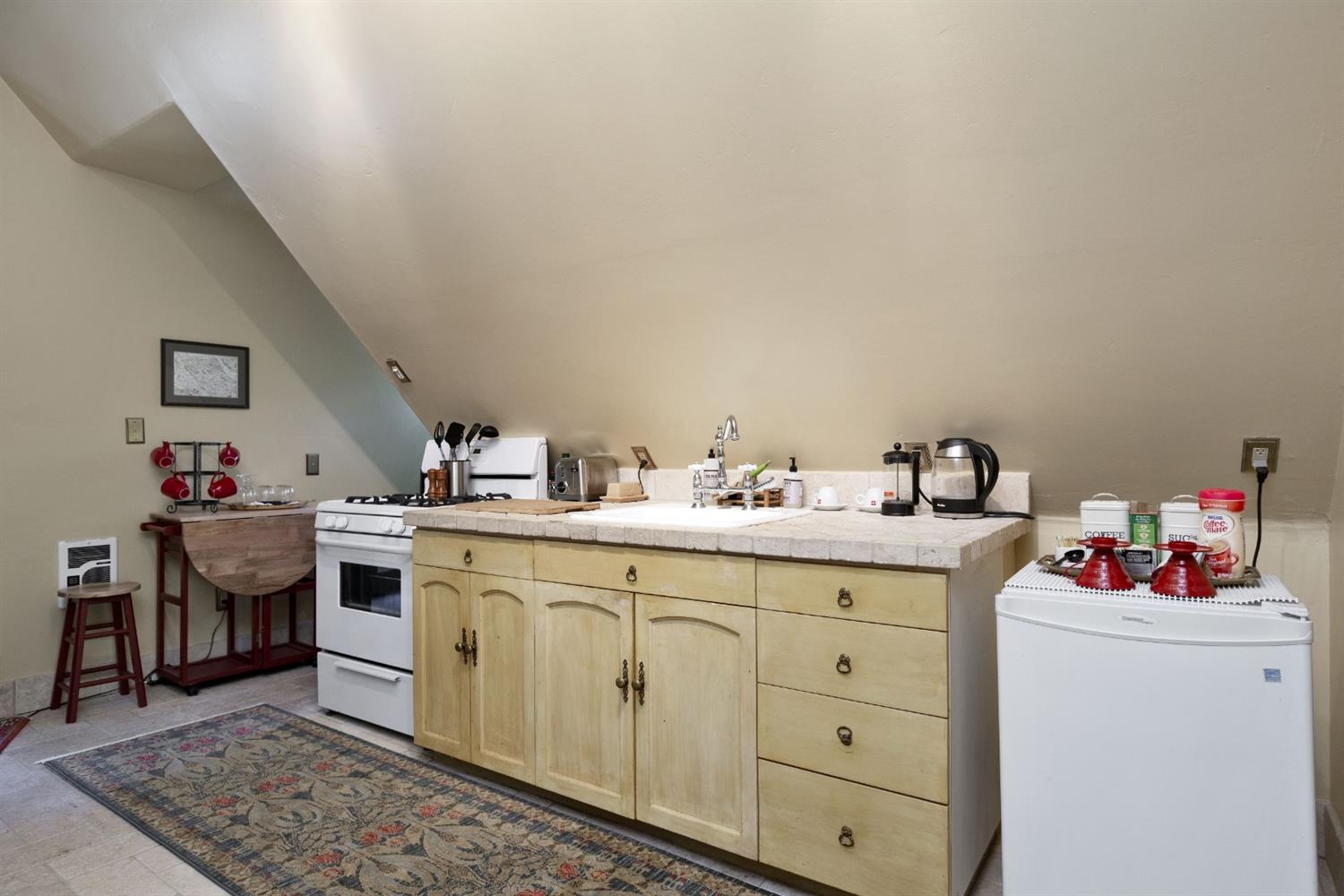 267 Fairview Road Ojai, CA 93023 - Photo 24 of 50 a utility room with cabinets washer and dryer