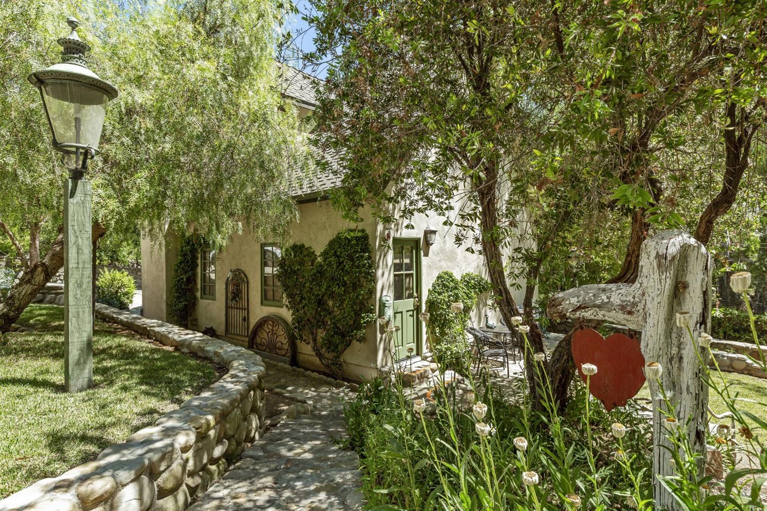 267 Fairview Road Ojai, CA 93023 - Photo 38 of 50 a backyard of a house with barbeque oven table and chairs