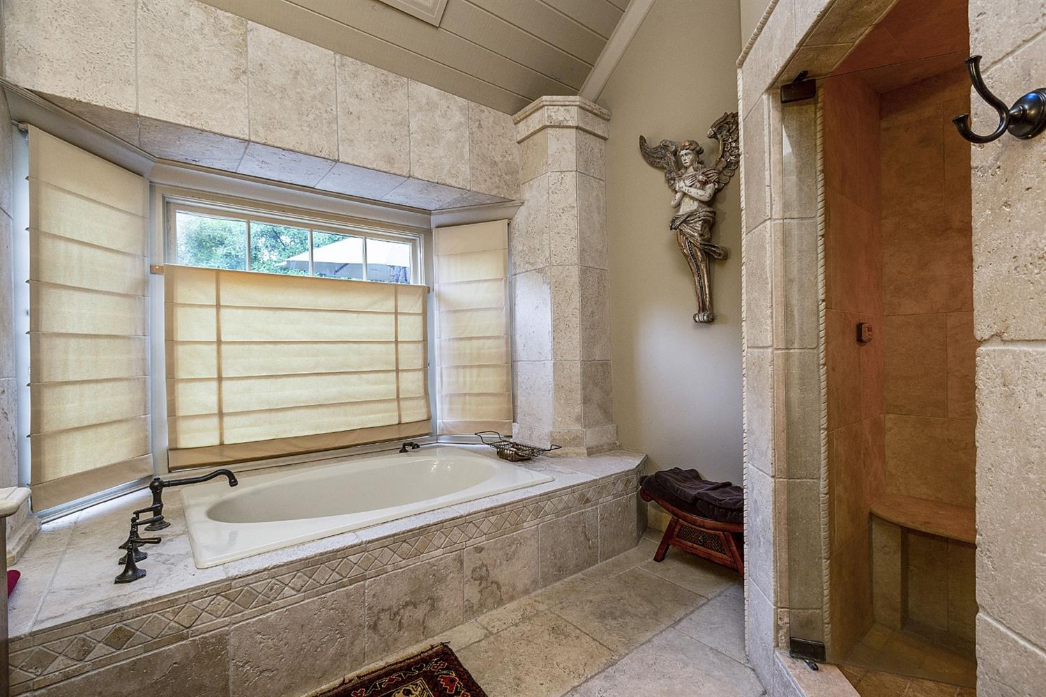 267 Fairview Road Ojai, CA 93023 - Photo 44 of 50 a bathroom with a granite countertop sink mirror and a bathtub