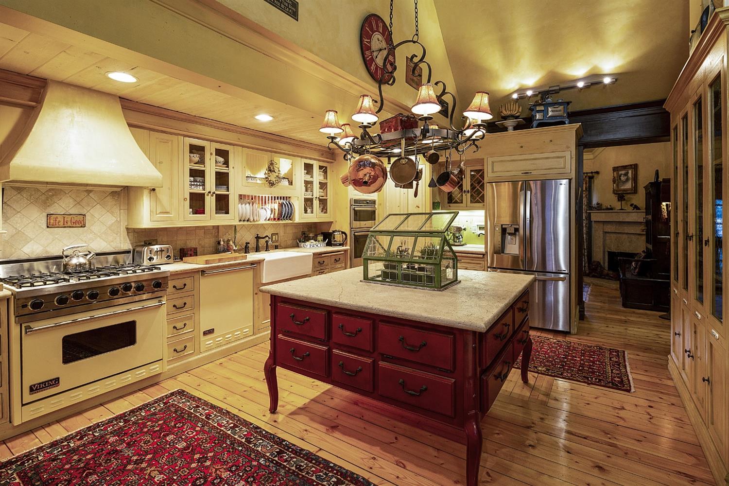 267 Fairview Road Ojai, CA 93023 - Photo 10 of 50 a kitchen with a stove cabinets and wooden floor