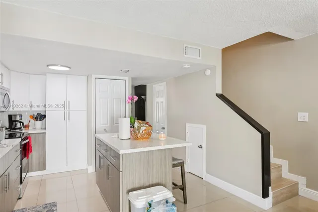 a view of kitchen center island and living room