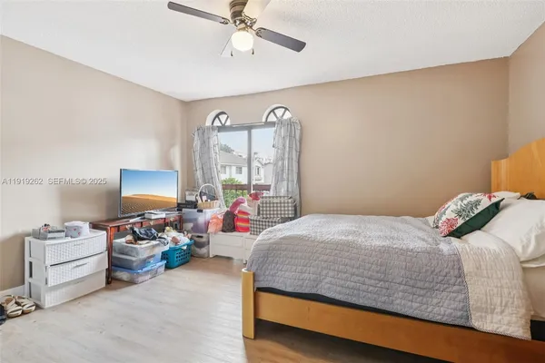 a bedroom with a bed and furniture