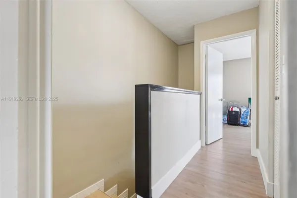 a view of a hallway with windows