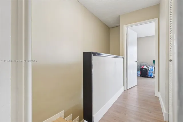 a view of a door and a window