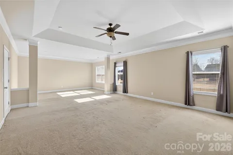 a view of empty room with a ceiling fan