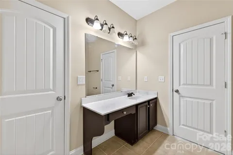 a bathroom with a sink and mirror