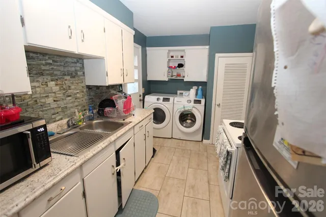a kitchen with a stove and a refrigerator