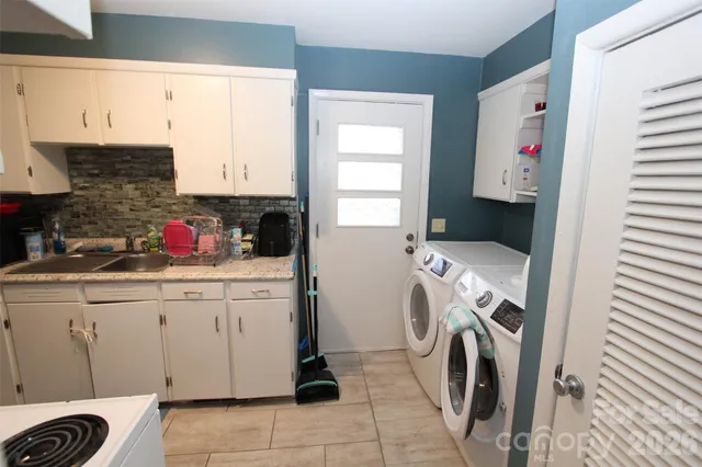 a view of a hallway with wooden floor and entryway