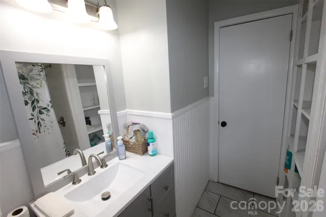 a bathroom with a sink toilet and vanity