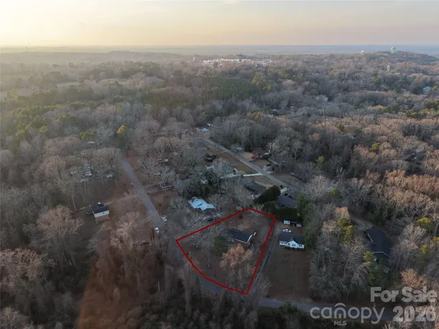 an aerial view of residential house and green space