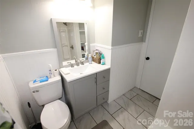 a balcony view with chairs and wooden floor
