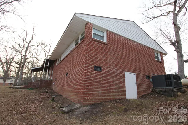 a brick building with a bench in front of it