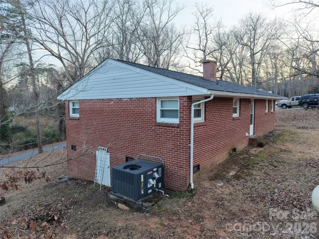 a front view of house with yard and trees
