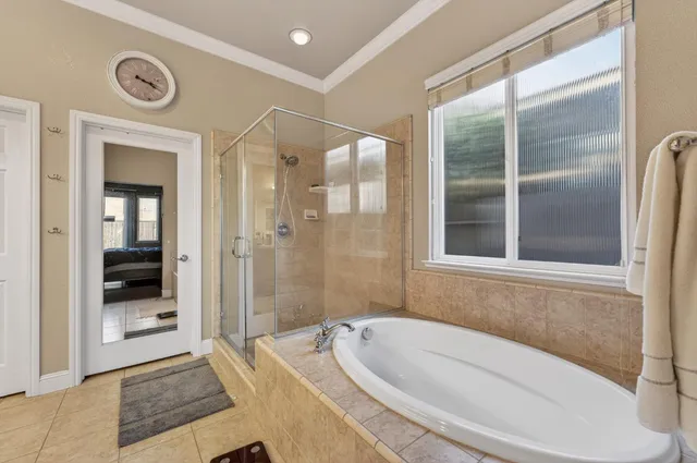 a bathroom with a bathtub and shower