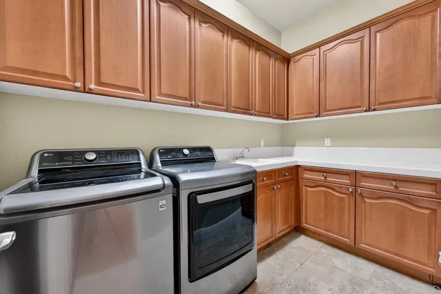 a view of a patio with couches and table with potted plants
