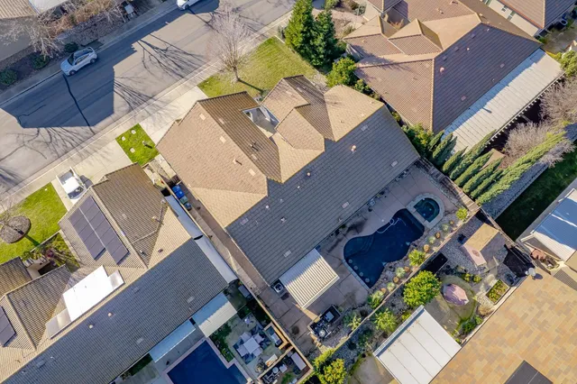 an aerial view of residential building and lake