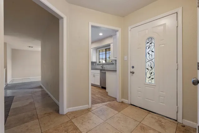 a kitchen with stainless steel appliances granite countertop a sink and cabinets