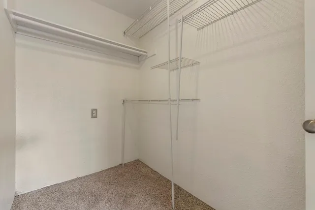 a bathroom with a granite countertop sink a toilet and bathtub