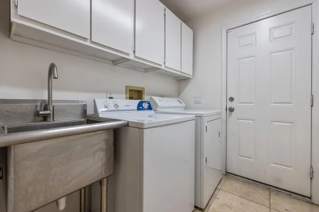 a view of a backyard with swimming pool