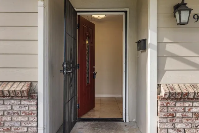 a view of a mirror and a door