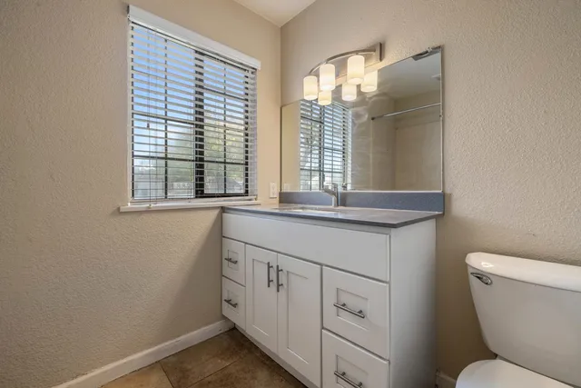 a bathroom with a bathtub and window